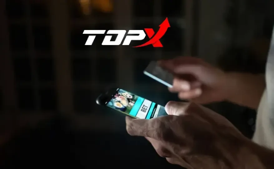Imagen de marca de TopX: manos con un teléfono
